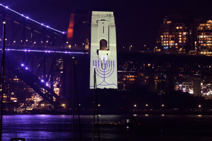 A menorah was projected on to the pylon of the Sydney Harbour Bridge during a tribute to the victims of the Bondi terror attack during the New Year's Eve celebrations in Sydney. Photograph: Dan Himbrechts/EPA